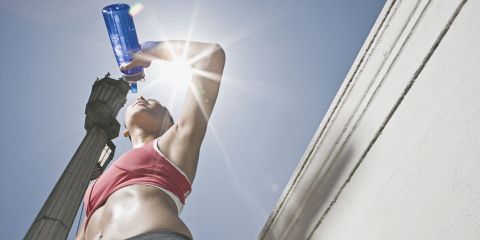 Female Athlete drinking a Sports Drink